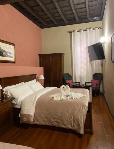 Cama o camas de una habitación en Borgo Pio 91