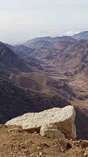 a large rock sitting on the side of a mountain at family home Lodge in Dana