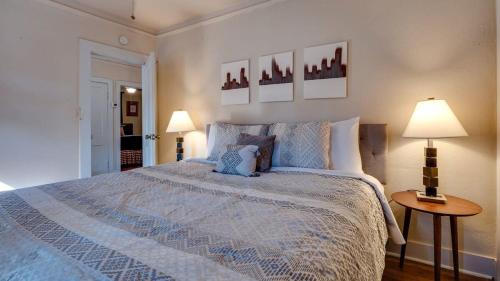 a bedroom with a large bed and two lamps at Retro Rainbow at Herb River- Flamingo Flat #4 in Savannah