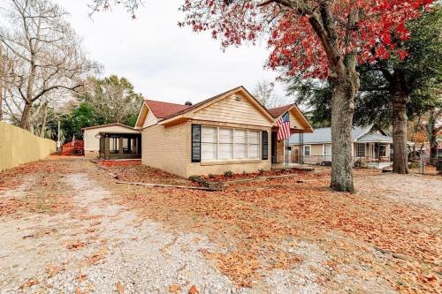 a house with an american flag in the driveway at 15mins to Downtown- Adorable on Taylor Both Units in West Columbia