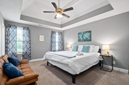 a bedroom with a bed and a ceiling fan at Laid-Back on Lancelot Lane in Clarksville