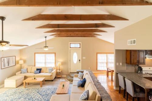 a living room with a couch and a table at Centrally Located - The Delightful Doubles - Unit C in Columbus