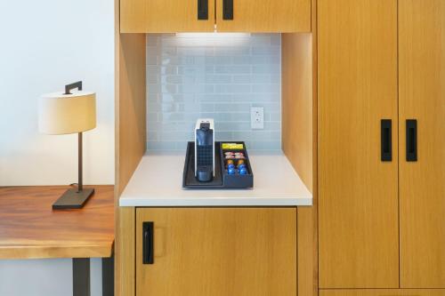 a room with a counter with a phone on it at Renaissance Honolulu Hotel & Spa in Honolulu