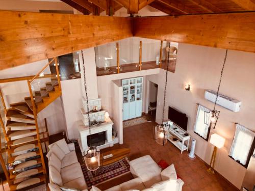 an overhead view of a living room with a staircase at VillaDelphia in Kefallonia