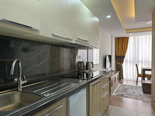 a kitchen with a sink and a counter top at Nurel Shark Residence in Kyrenia