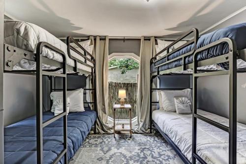 a room with two bunk beds and a window at Sweet Sunny Retreat- Main House in Savannah