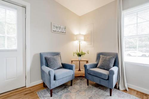 two blue chairs and a lamp in a living room at Mins to USC, Hospital, Zoo! Columbia Duet- 2 Units in West Columbia