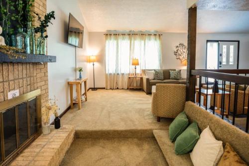 a living room with a couch and a fireplace at Near Hospital & Dining- Merry on Moorcroft in Montgomery