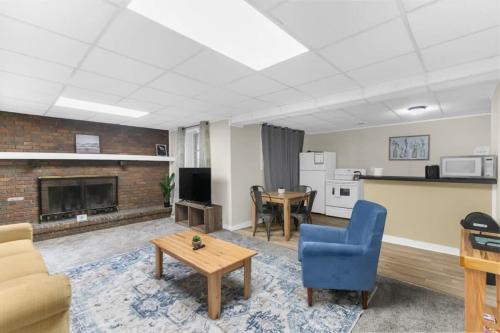 a living room with a couch and a table at Two Kitchens Family Friendly in Forestdale in Birmingham