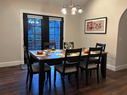 a dining room table and chairs in a room at Spacious & Beautiful with Double Decks in Chapel Area in Sedona