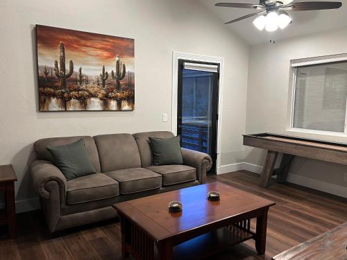 a living room with a couch and a table at Spacious & Beautiful with Double Decks in Chapel Area in Sedona