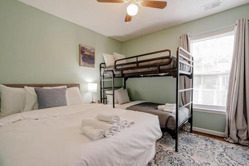 a bedroom with two bunk beds and a window at Close to USC & Midtown-Downtown - Newly Renovated in Columbia