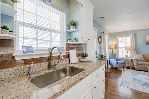 a kitchen with a sink and a living room at Close to USC & Midtown-Downtown - Newly Renovated in Columbia