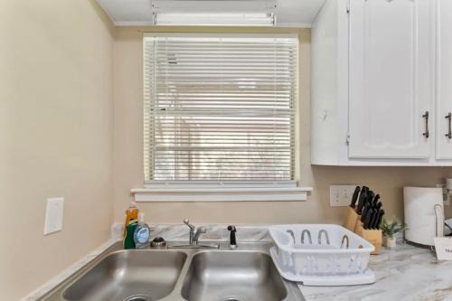 a kitchen with a sink and a window at Near Parks Dining & Shopping - Glade Park Gem in Montgomery