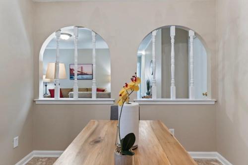 a dining room with two mirrors and a wooden table at Near Parks Dining & Shopping - Glade Park Gem in Montgomery
