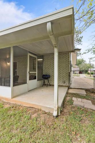a covered porch of a house with a grill at Near Parks Dining & Shopping - Glade Park Gem in Montgomery