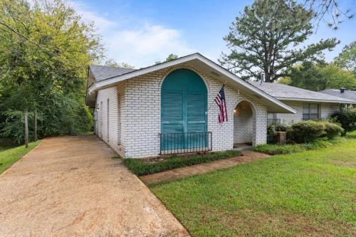 a house with a flag in the front of it at Near Parks Dining & Shopping - Glade Park Gem in Montgomery