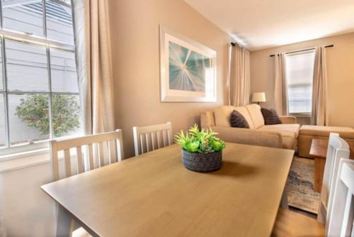 a living room with a table and a couch at The Delightful Doubles- Unit B- Centrally Located in Columbus