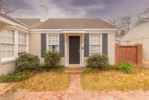 a house with a brick driveway in front of it at The Delightful Doubles- Unit B- Centrally Located in Columbus
