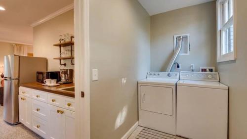 a kitchen with a washer and dryer in it at Studio with Gazebo-Swanky Savannah Style in Savannah