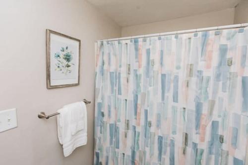 a bathroom with a shower with a shower curtain at Forest Park Place in Birmingham