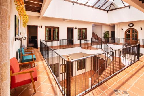 a large room with a staircase in a building at Hotel Casa Moreno La vega C in La Vega