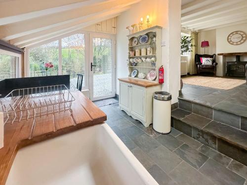 a kitchen with a bath tub in a room at Millies Place in Saint Stephen