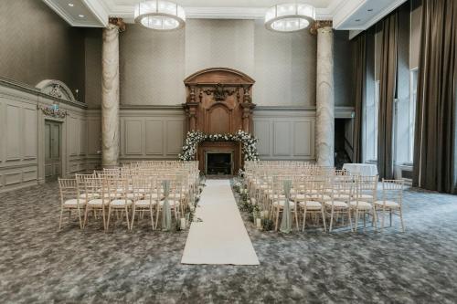 a banquet hall with rows of chairs and a altar at voco Grand Central Glasgow by IHG in Glasgow