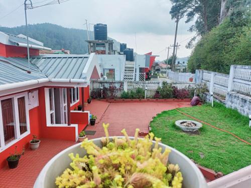 a bowl of food on a balcony of a house at QUEENS COTTAGE - individual cottage in Ooty