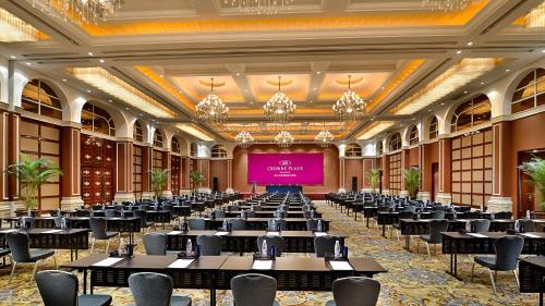 a large banquet hall with tables and a projection screen at Crowne Plaza Zhenjiang, an IHG Hotel in Zhenjiang