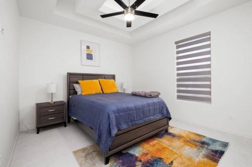 a bedroom with a bed and a ceiling fan at Quinta Real 5133 QR1 in McAllen