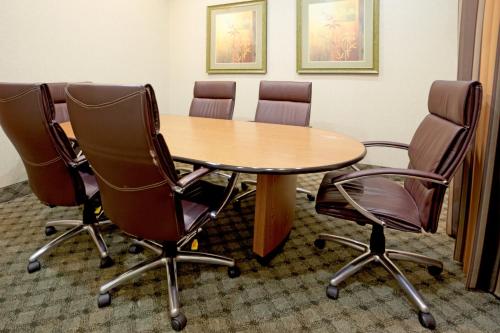 a conference room with a table and four chairs at Holiday Inn Express Hotel & Suites Zapata by IHG in Zapata