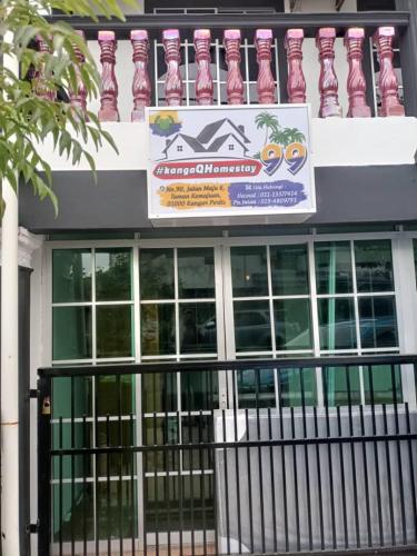 a building with a sign on the side of it at #KangaQHomestay99 in Kangar