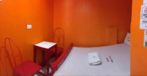 Postel nebo postele na pokoji v ubytování WJV INN NAGA