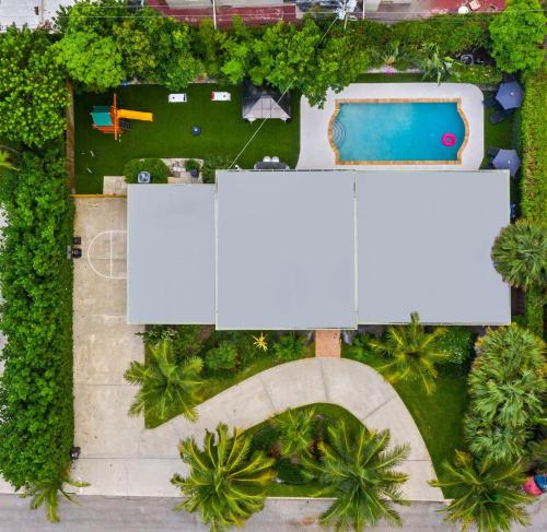 an overhead view of a park with a white sign at Family retreat wheated pool game room in West Palm Beach