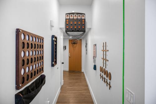 a hallway with a room with an apple watch on the wall at Park Lux PlayHouse in San Diego