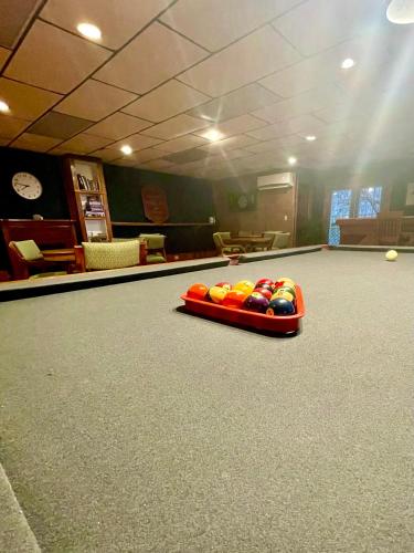 a bowling lane with balls in a lane in a billiard at Skyline Village Inn in Spruce Pine
