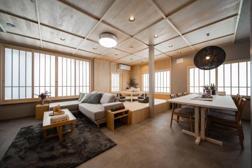 a living room with a couch and a table at THE CELESTIAL in Nakafurano