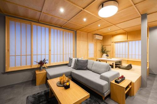 a living room with a couch and a table at THE CELESTIAL in Nakafurano