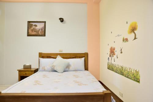 Katil atau katil-katil dalam bilik di Fong Su B&B