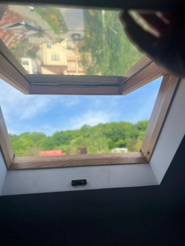 a view of a window in a room at Apartament Mansarda Venus in Râmnicu Vâlcea