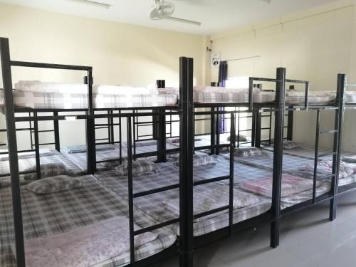 Ένα ή περισσότερα κρεβάτια σε δωμάτιο στο ศูนย์สัมมนาอาร์มทอง