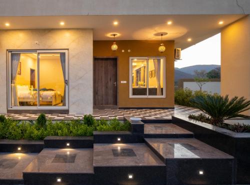 a house with a view of a bedroom at ELIVAAS 2 BHK Pet Friendly Villa with Pvt Pool - Heaven in Hill in Udaipur