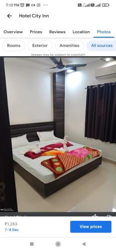 ein Bild eines Bettes in einem Zimmer in der Unterkunft Hotel City inn in Gaya