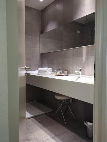 a bathroom with a sink and a toilet at Boiardo Hotel in Scandiano