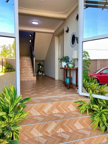 a hallway of a house with a wooden floor at Athena Apartments in Kampala