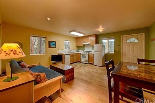 a kitchen and living room with a couch and a table at Suite Sunshine A in Yosemite West