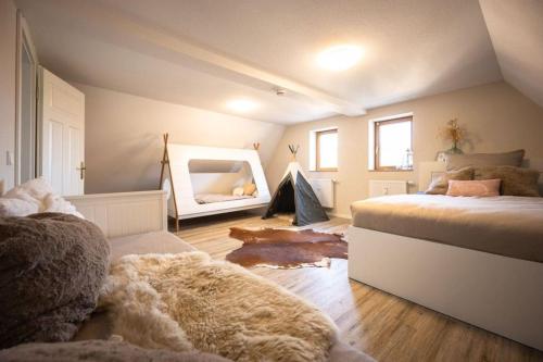 a bedroom with a large bed and a mirror at Villa Vanilla im Burgdorf 11 P. 