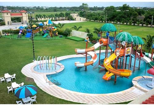 an image of a water park with a water slide at Nulife Resort in Jamnagar