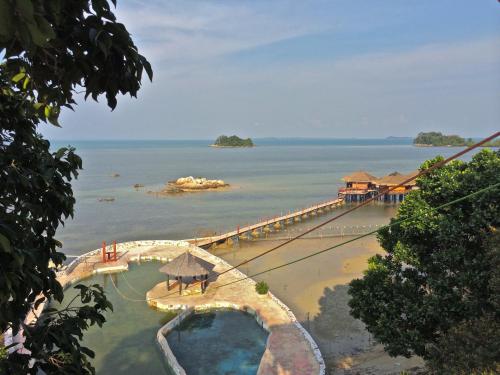 a view of a pier in the water at LooLa Adventure Resort in Telukbakau